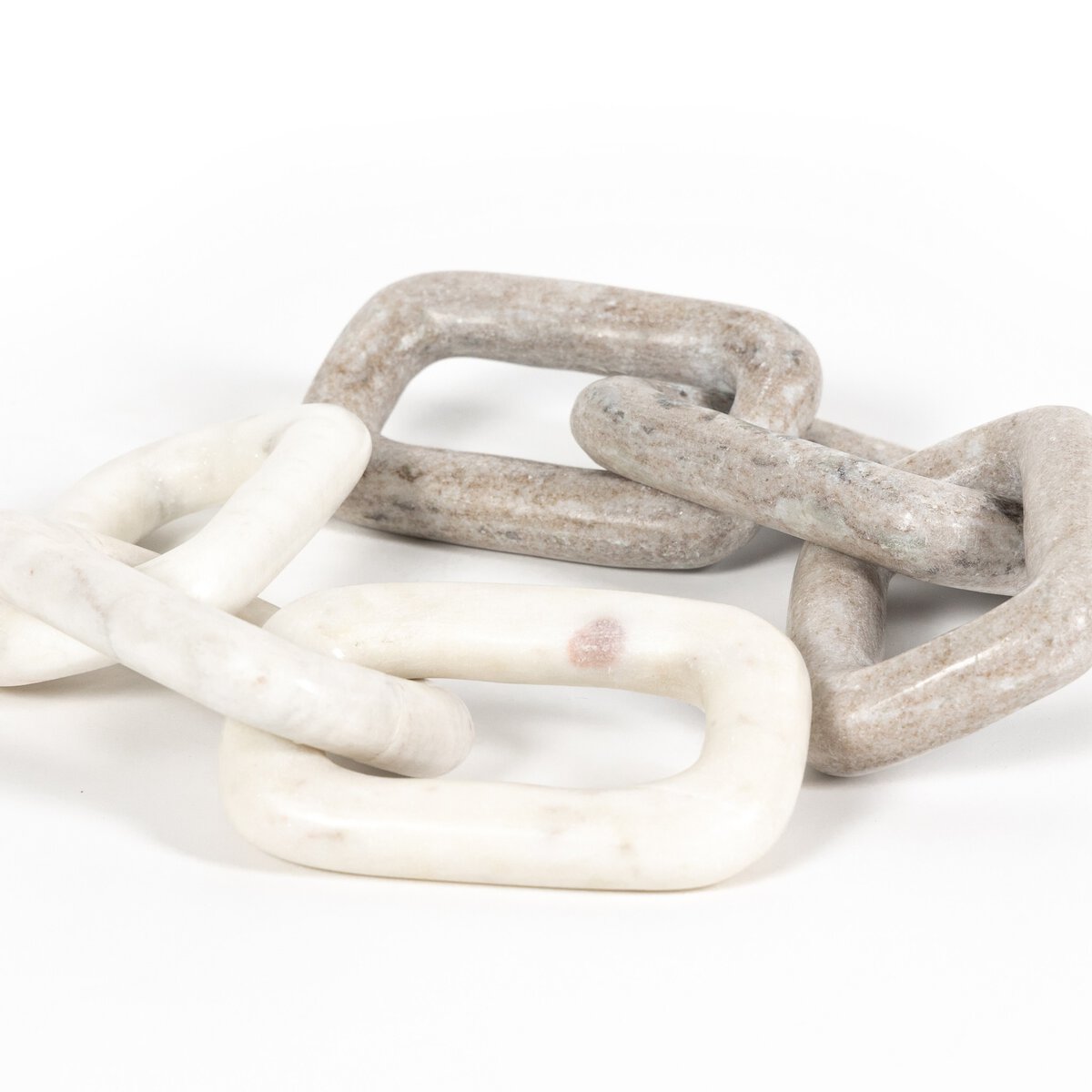 Creamy taupe and white marble chains shown together